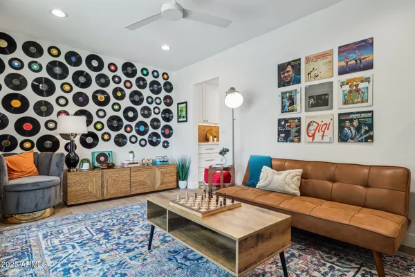a living room with furniture and a potted plant