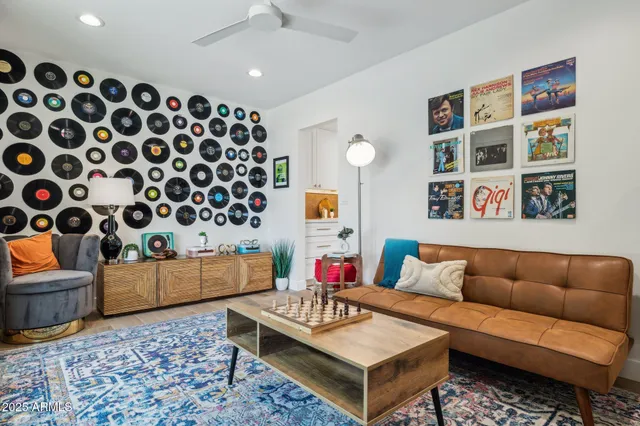 a living room with furniture and a potted plant