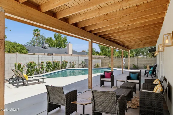 a view of deck with furniture and garden view