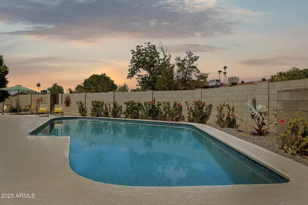 a view of a swimming pool with a lake view