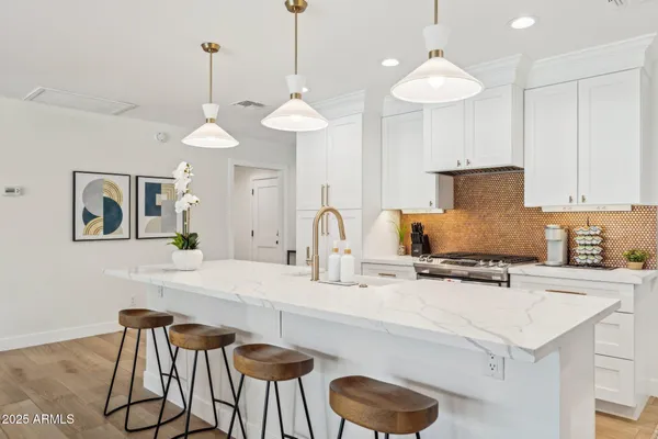 a stove top oven sitting inside of a kitchen