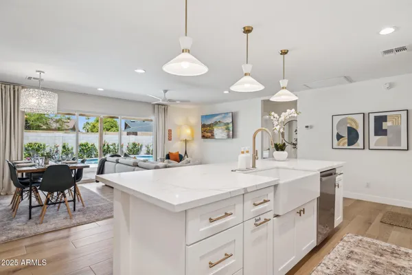 a kitchen with refrigerator and microwave