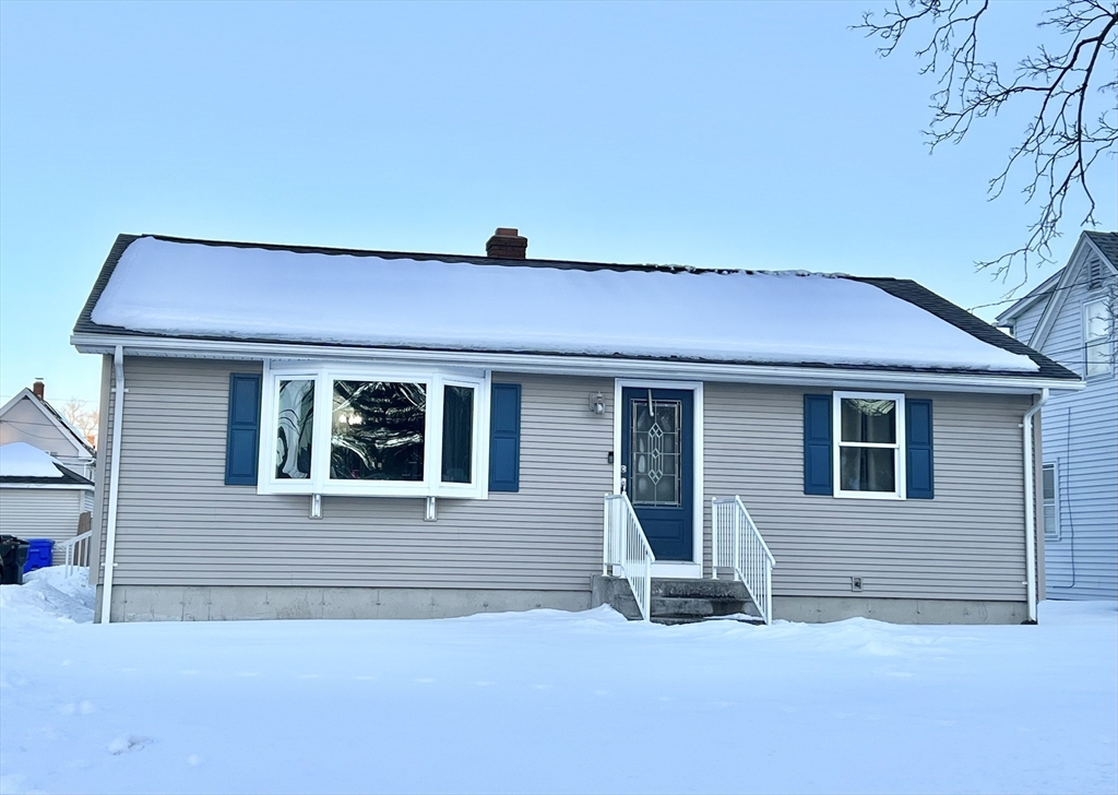 107 Enfield Street Springfield, MA 01151 - Photo 1 of 20 a front view of a house with a yard