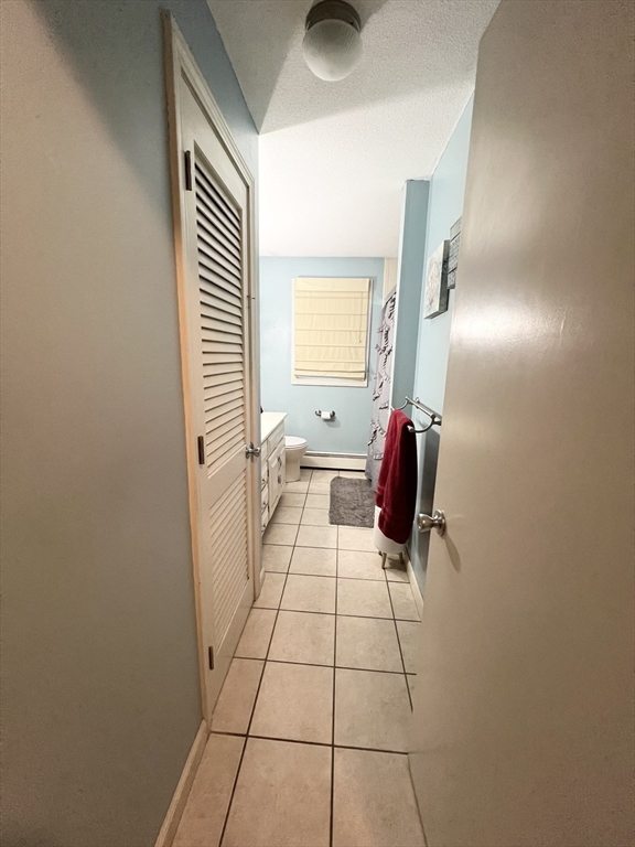 107 Enfield Street Springfield, MA 01151 - Photo 11 of 20 a bathroom with a sink and mirror