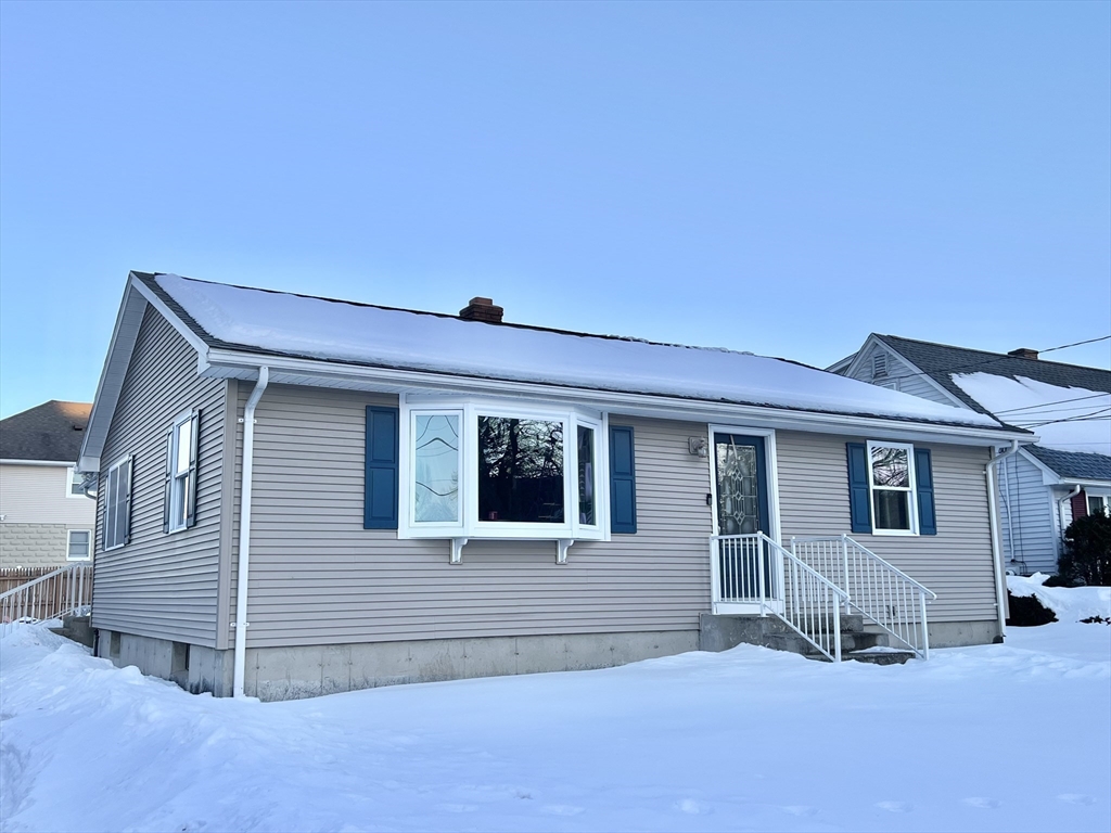 107 Enfield Street Springfield, MA 01151 - Photo 2 of 20 a front view of a house with garage