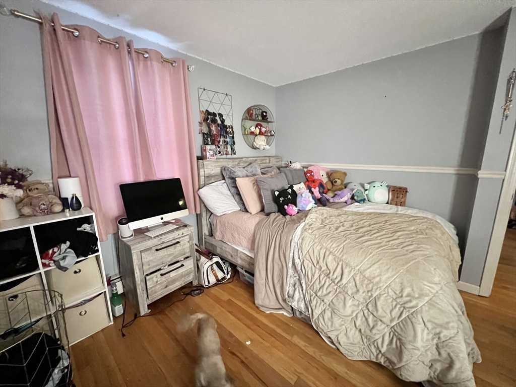 107 Enfield Street Springfield, MA 01151 - Photo 8 of 20 a bedroom with a bed and a window