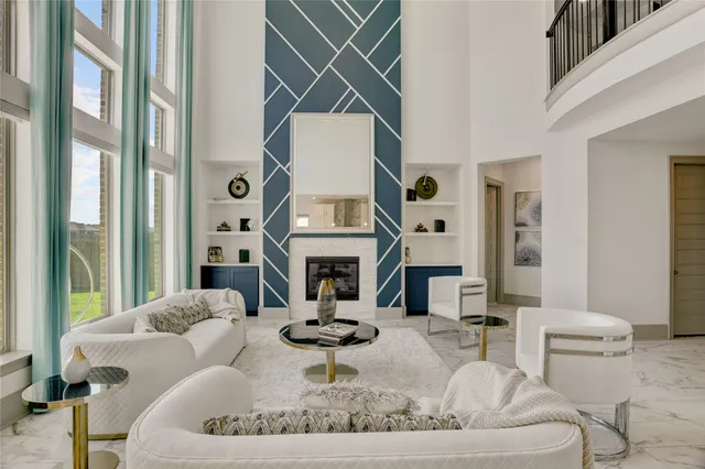 a living room with furniture a fireplace and a chandelier