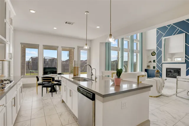 a aerial view of a house with a garden and lake view