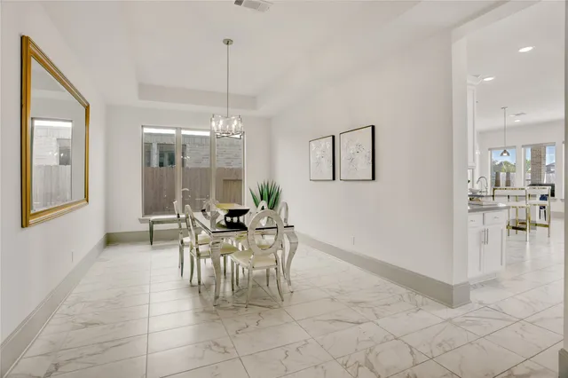 a kitchen with white cabinets and a sink