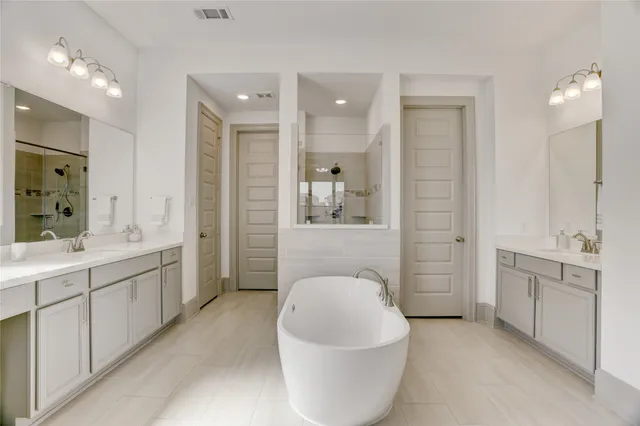 a bed room with a bed and a large window