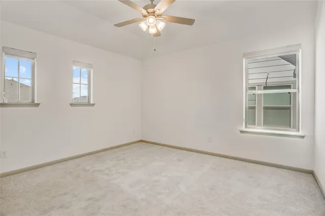 a living room with furniture and wall paintings