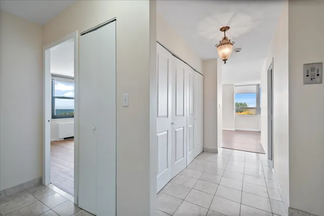 a view of an empty room and a bathroom