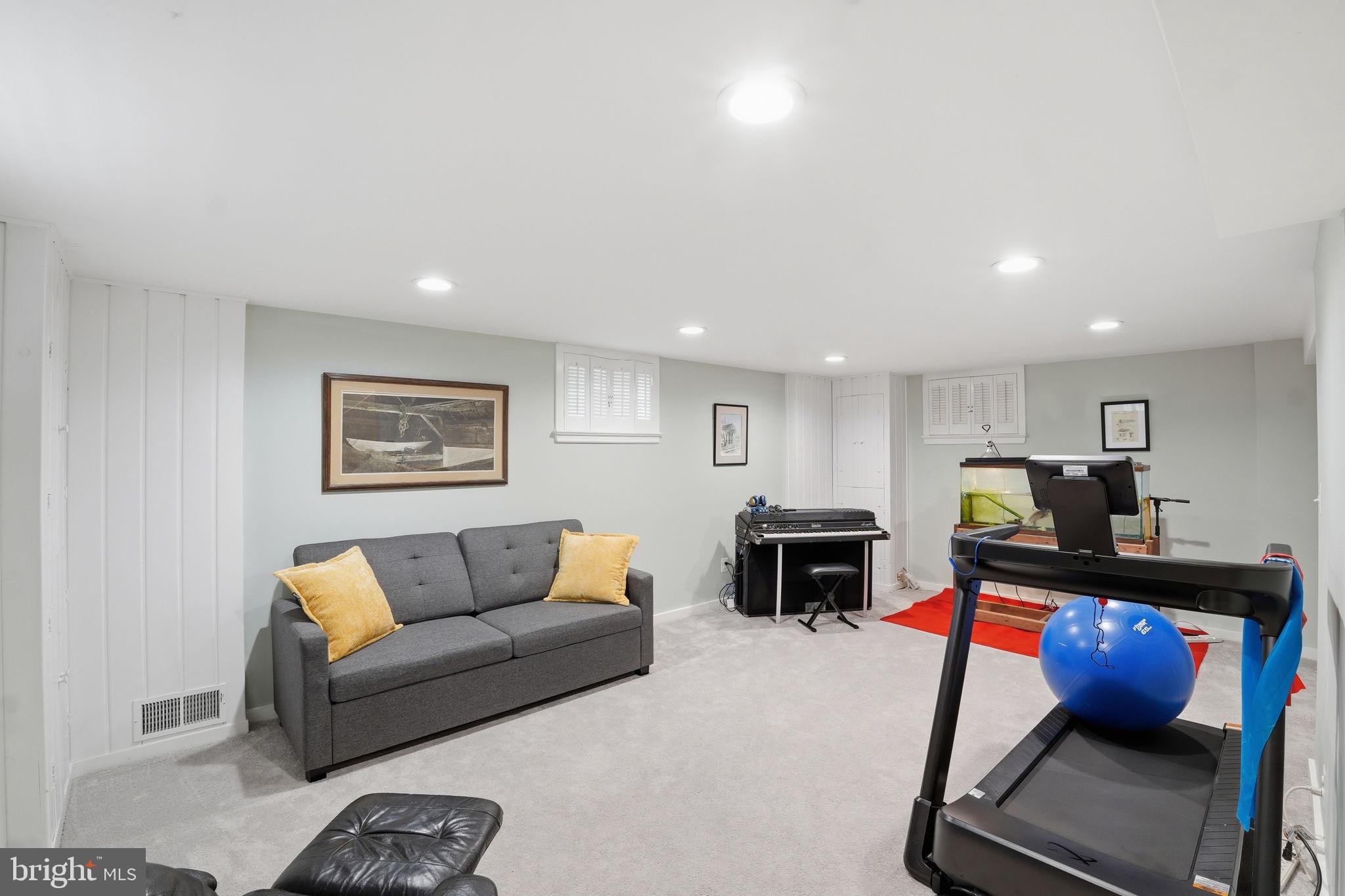 9601 Bruce Drive Silver Spring, MD 20901 - Photo 25 of 29 Versatile basement retreat for relaxation.