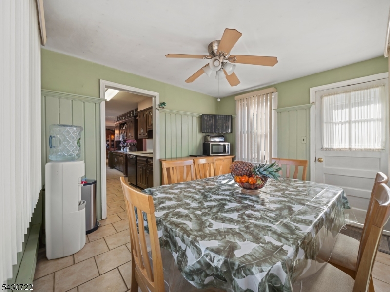 544 Goffle Hill Road Hawthorne, NJ 07506 - Photo 7 of 26 a bed room with a bed and a mirror