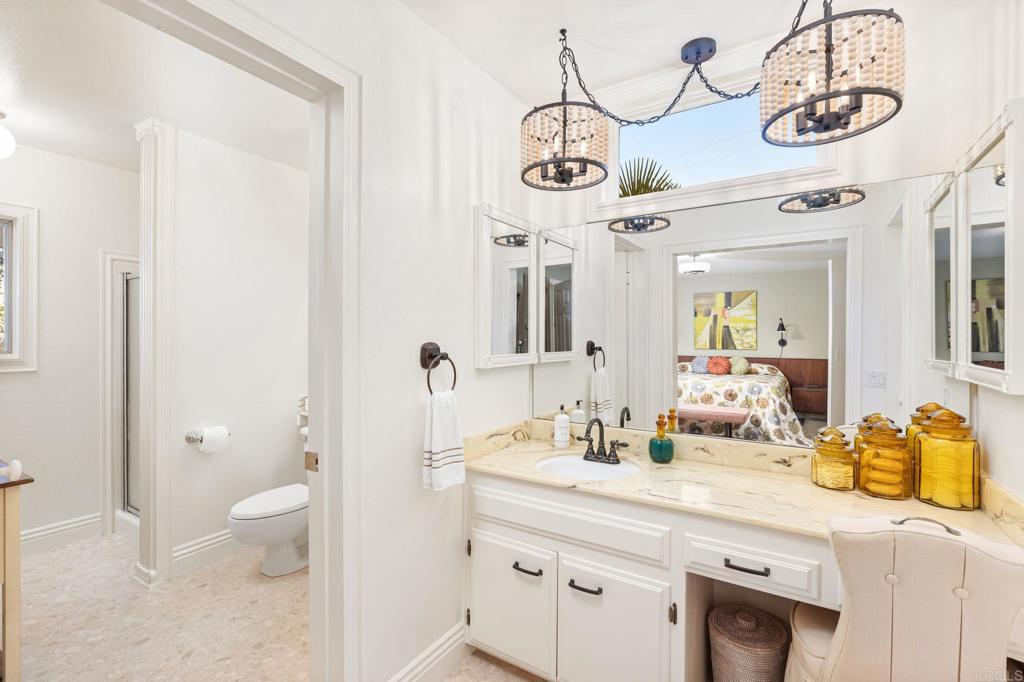 29460 Twain Valley Center, CA 92082 - Photo 21 of 75 a bathroom with a sink a toilet and a mirror