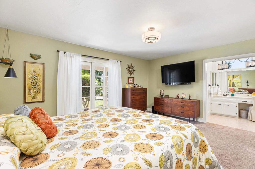 29460 Twain Valley Center, CA 92082 - Photo 24 of 75 a bedroom with a bed and a flat screen tv