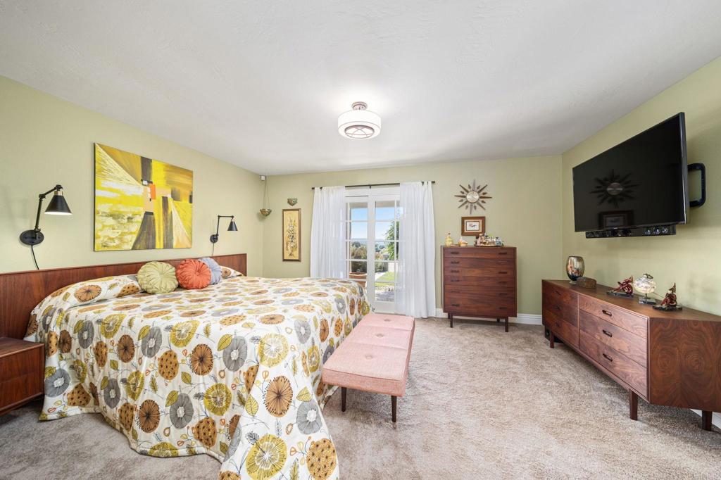 29460 Twain Valley Center, CA 92082 - Photo 26 of 75 a bedroom with a bed and flat screen tv