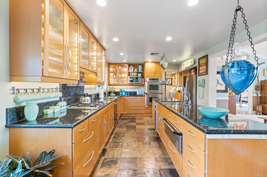 29460 Twain Valley Center, CA 92082 - Photo 36 of 75 a view of a kitchen with stainless steel appliances granite countertop a sink and a wooden floors