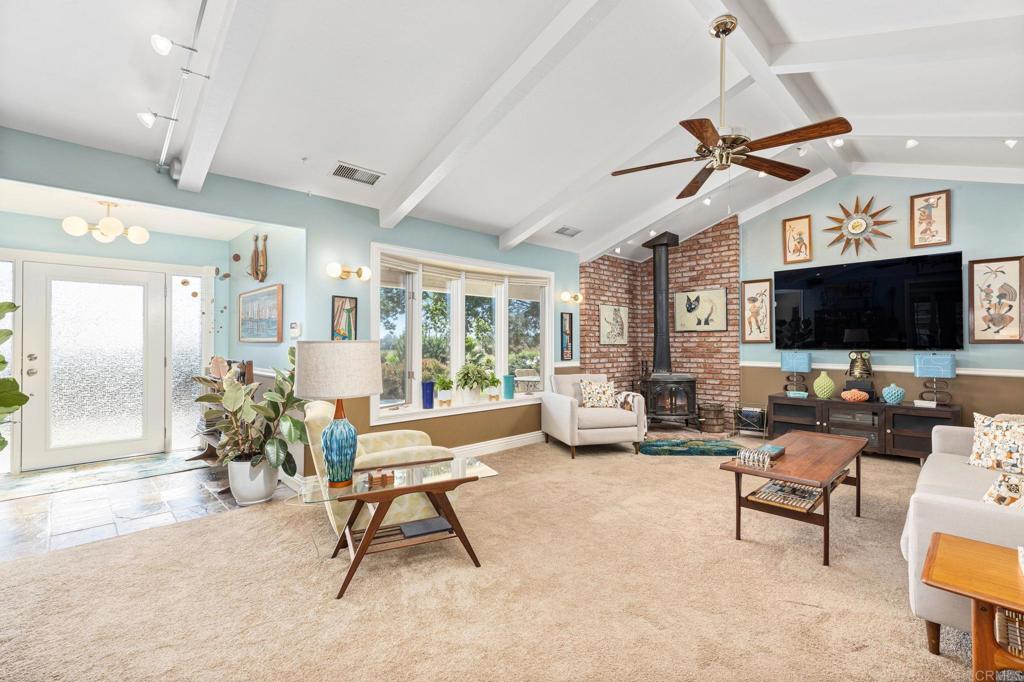 29460 Twain Valley Center, CA 92082 - Photo 6 of 75 a living room with furniture and a flat screen tv