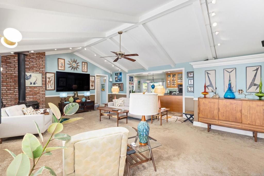 29460 Twain Valley Center, CA 92082 - Photo 10 of 75 a living room with furniture and a flat screen tv