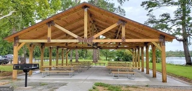 a view of a swimming pool with an outdoor space and seating area