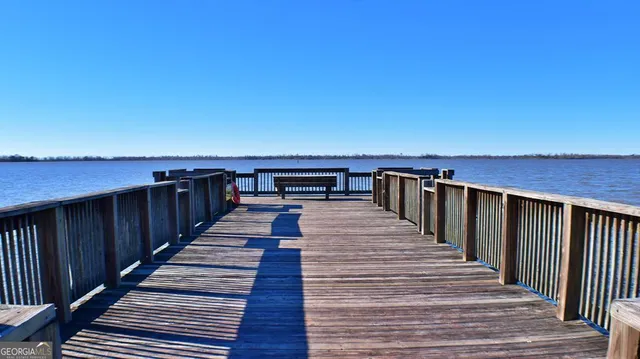 a view of wooden floor with a lake view