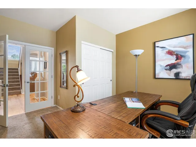 a bedroom with furniture and wooden floor