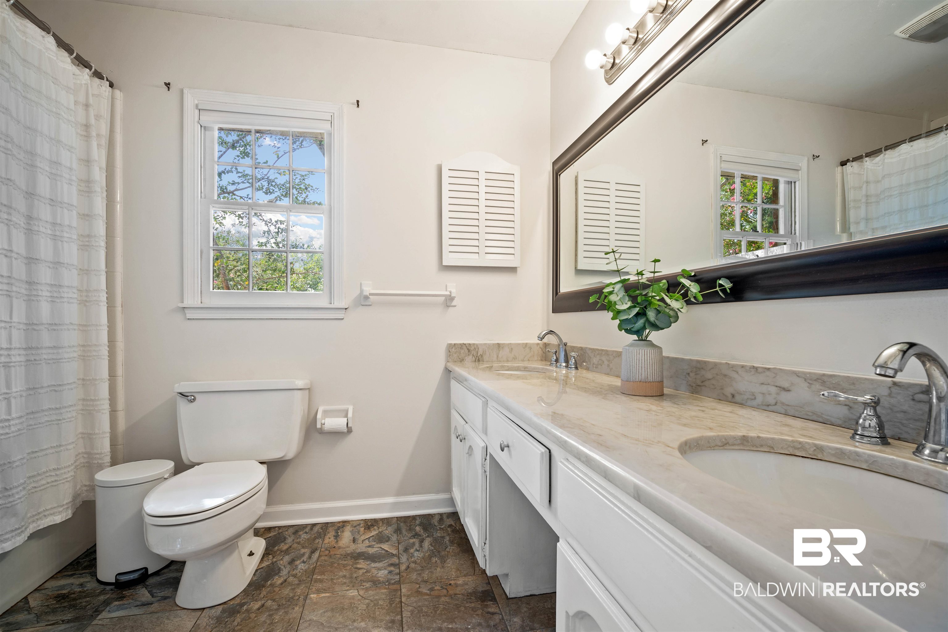 700 Eliza Jordan Road North Mobile, AL 36608 - Photo 29 of 44 Full bathroom with double vanity and stone finish floors