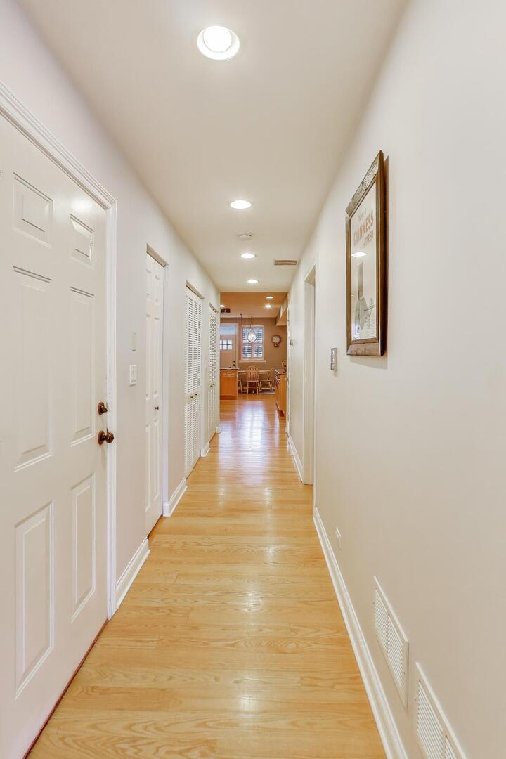 2537 North Hamlin Avenue, Unit 1S Chicago, IL 60647 - Photo 3 of 22 a hallway with wooden floor and furniture