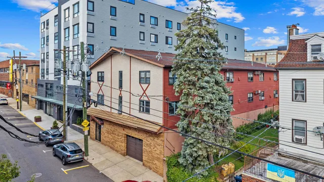 a view of a brick building with many windows