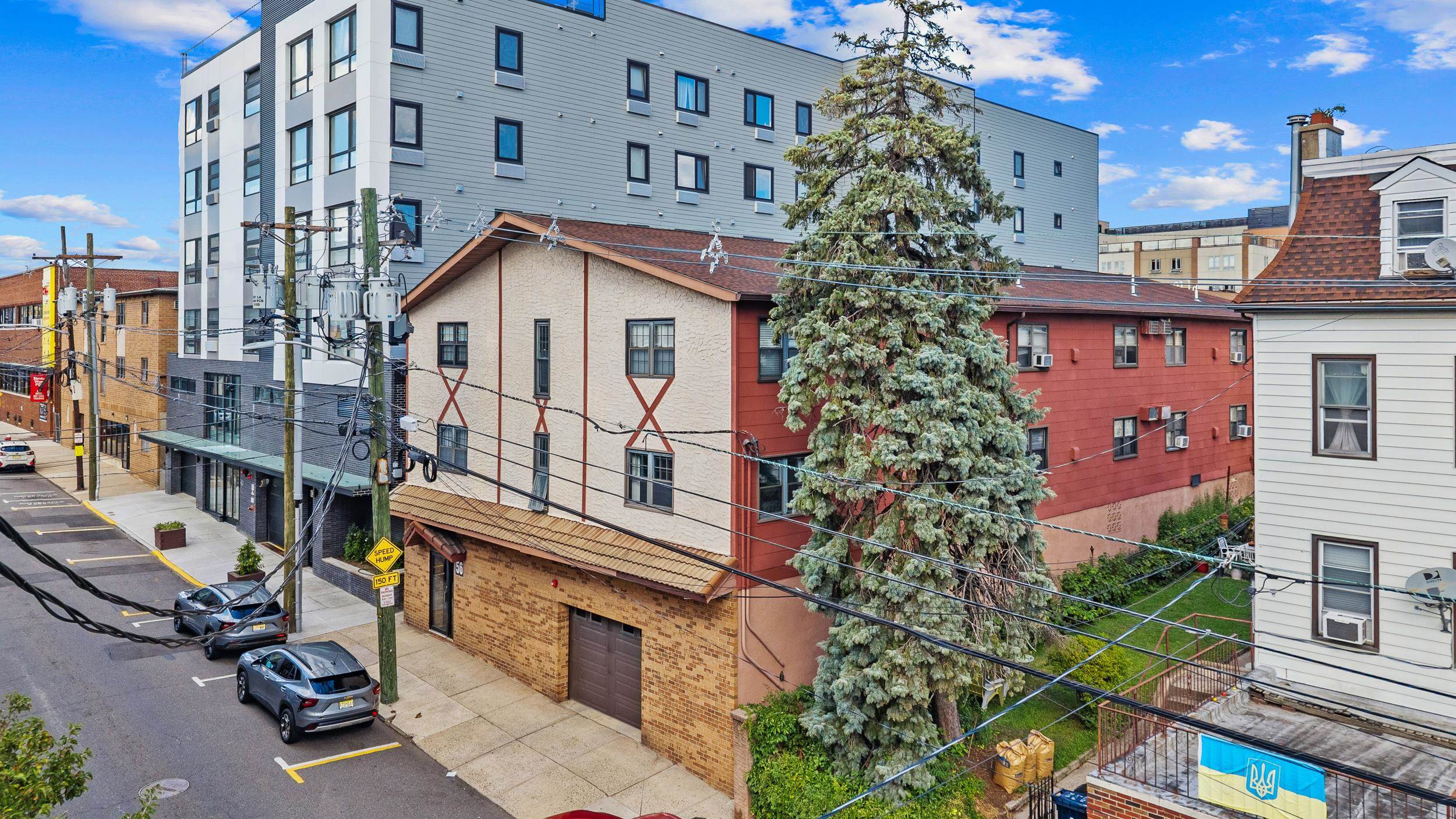 56 68th Street, Unit 8 Guttenberg, NJ 07093 - Photo 1 of 27 a view of a brick building with many windows