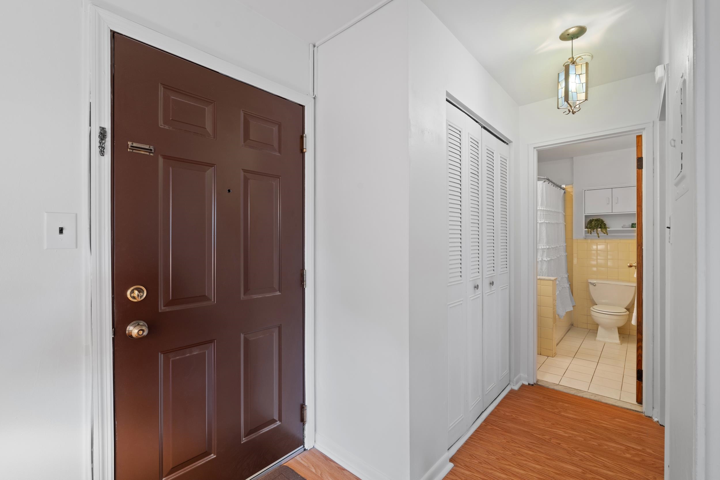 56 68th Street, Unit 8 Guttenberg, NJ 07093 - Photo 12 of 27 a view of a hallway with a elevator
