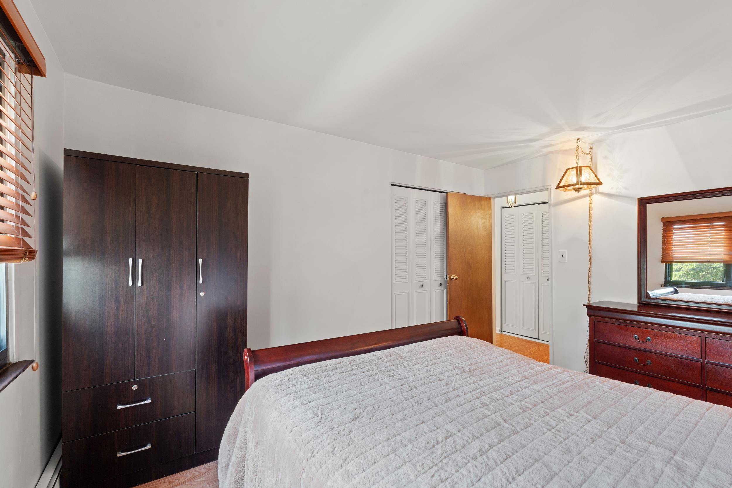 56 68th Street, Unit 8 Guttenberg, NJ 07093 - Photo 16 of 27 a bedroom with a bed and a dresser