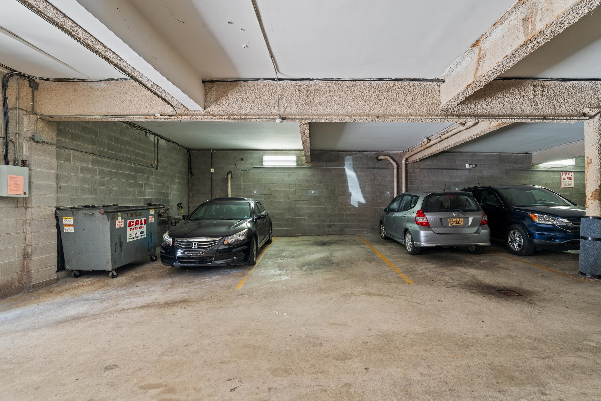56 68th Street, Unit 8 Guttenberg, NJ 07093 - Photo 18 of 27 a car parked in a parking garage