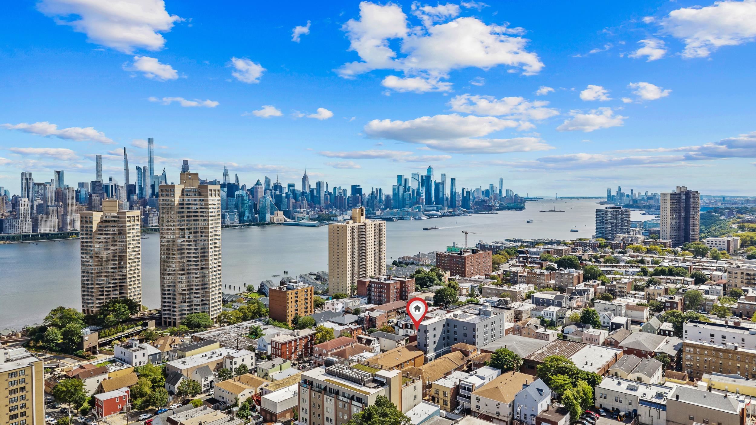 56 68th Street, Unit 8 Guttenberg, NJ 07093 - Photo 19 of 27 a view of a city with tall buildings