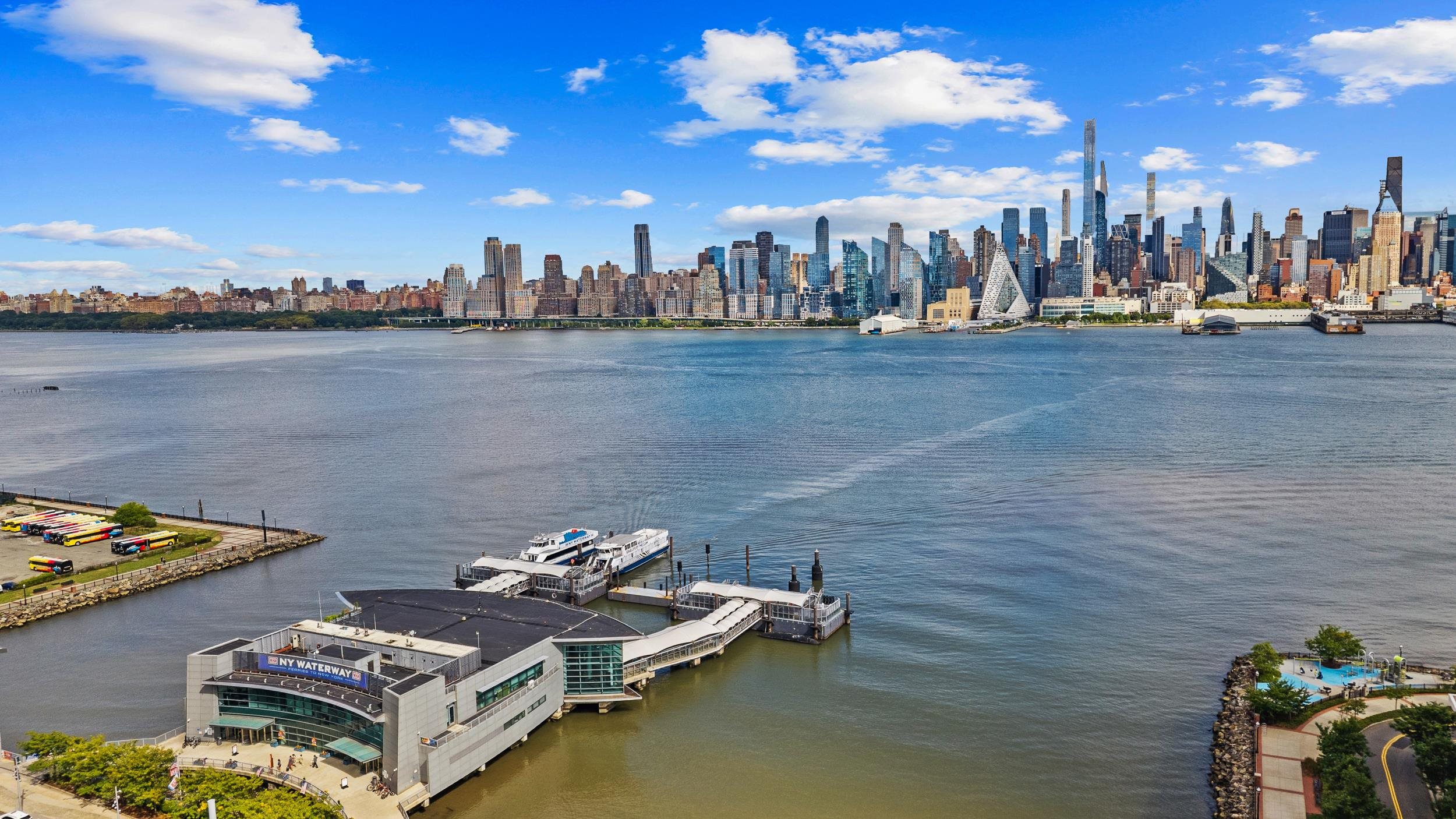 56 68th Street, Unit 8 Guttenberg, NJ 07093 - Photo 27 of 27 a view of a lake with lawn chairs