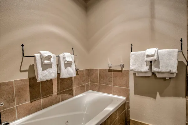 a bathroom with a bathtub and sink