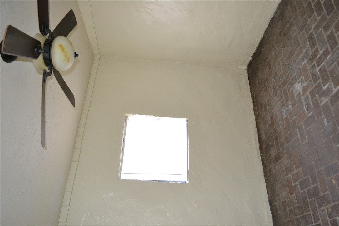 505 Foch Street Bryan, TX 77801 - Photo 13 of 17 Spare room with brick flooring and ceiling fan