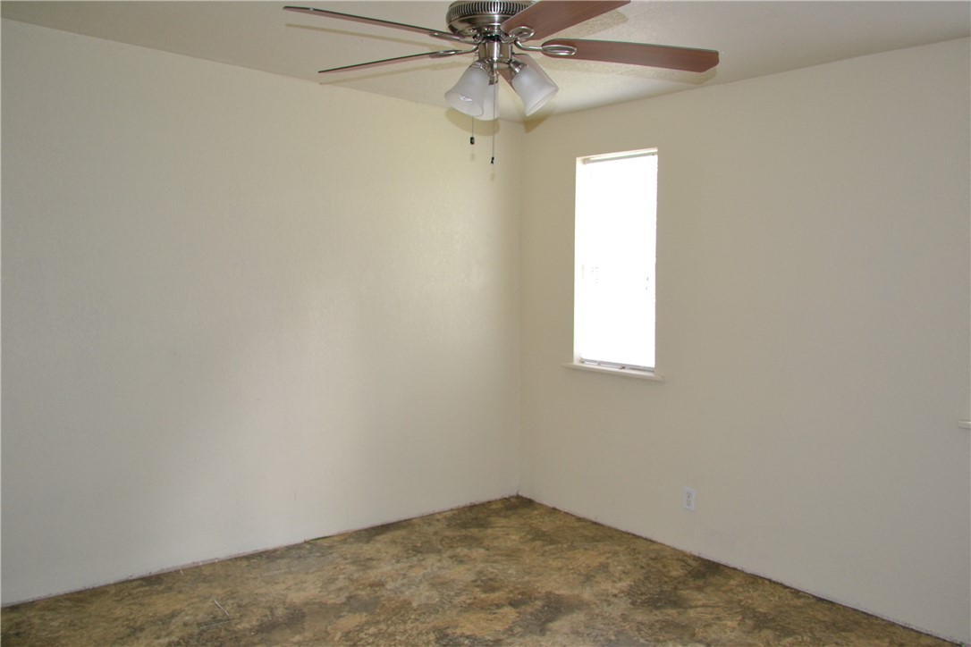 505 Foch Street Bryan, TX 77801 - Photo 14 of 17 Carpeted spare room with a ceiling fan