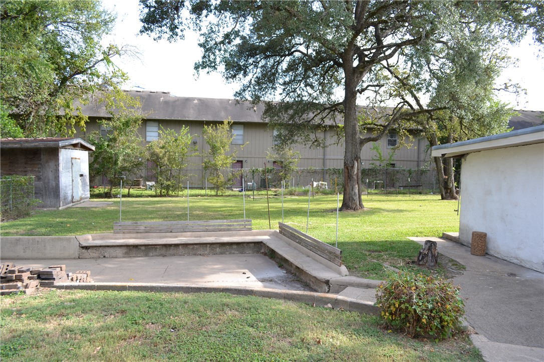 505 Foch Street Bryan, TX 77801 - Photo 16 of 17 View of yard featuring a patio and a shed