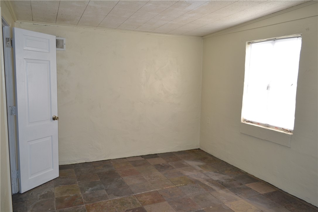 505 Foch Street Bryan, TX 77801 - Photo 5 of 17 Spare room featuring stone finish flooring