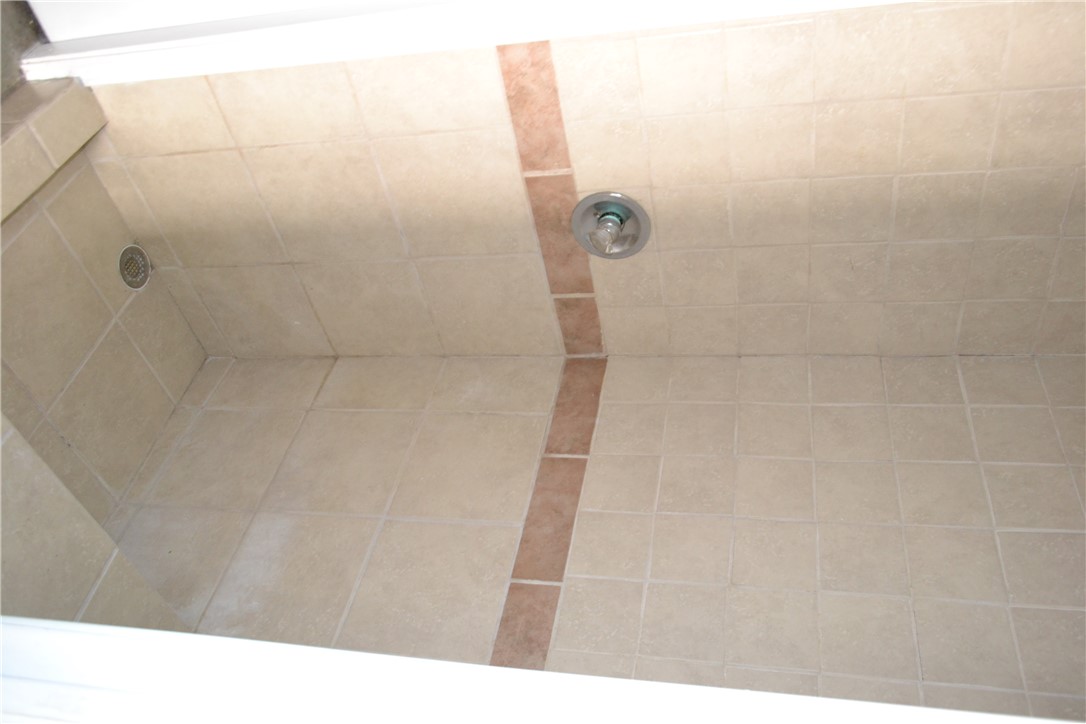 505 Foch Street Bryan, TX 77801 - Photo 9 of 17 Bathroom featuring tiled shower