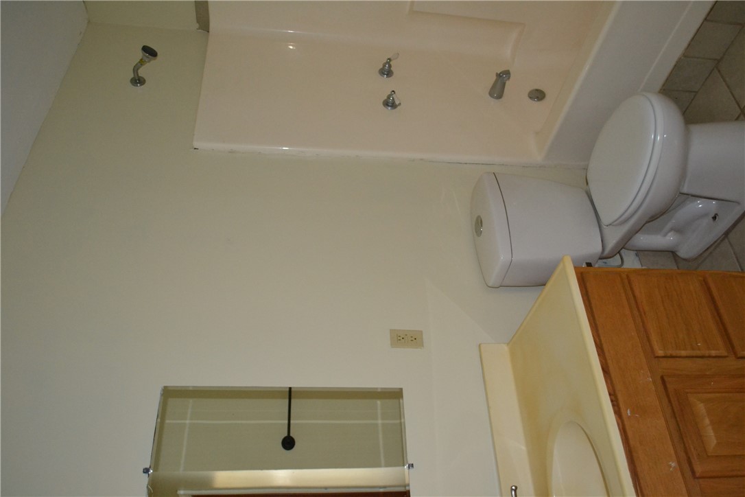 505 Foch Street Bryan, TX 77801 - Photo 10 of 17 Bathroom featuring light tile patterned floors, shower combination, and vanity