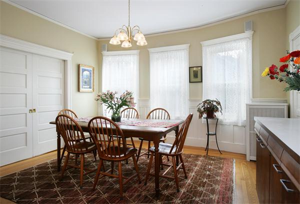 44 Harrison Street, Unit 2 Brookline, MA 02446 - Photo 5 of 6 a view of a dining room with furniture and wooden floor