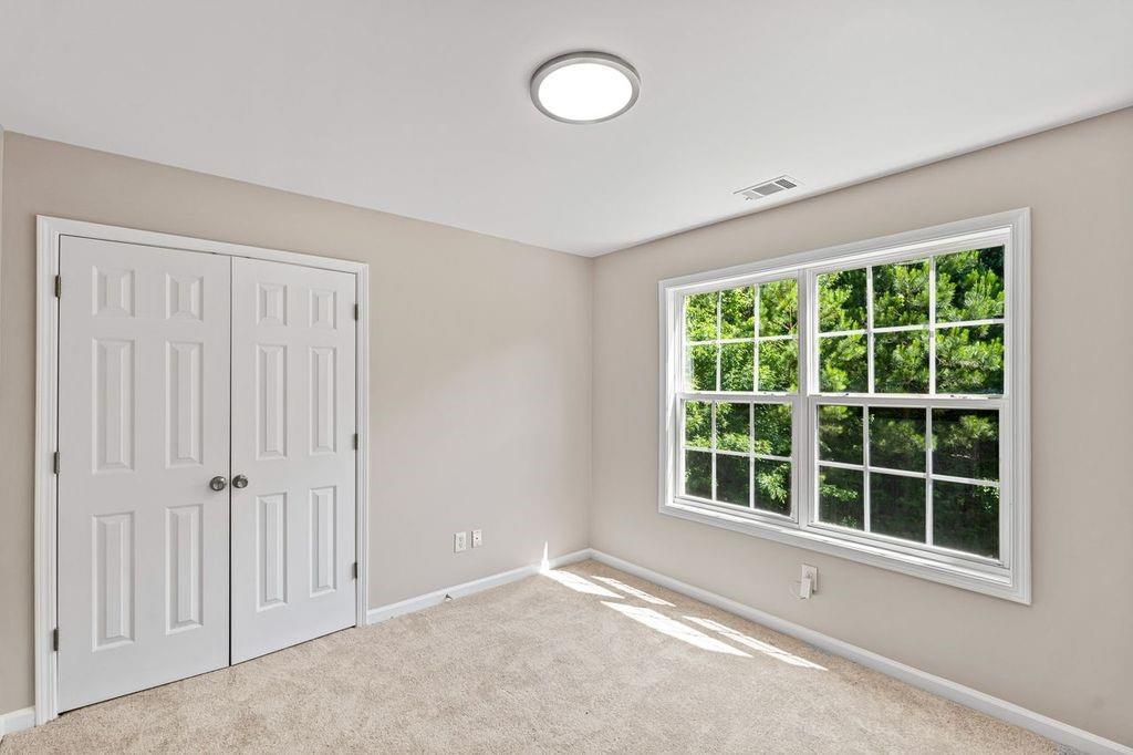 473 Greyhawk Way Fairburn, GA 30213 - Photo 21 of 34 an empty room with a window