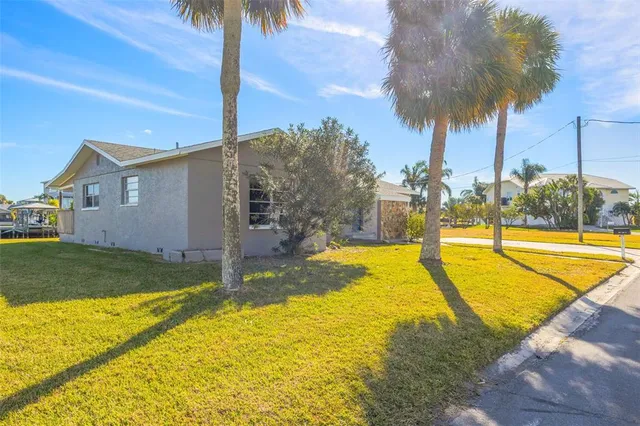 a kitchen with granite countertop a sink and a wooden floor