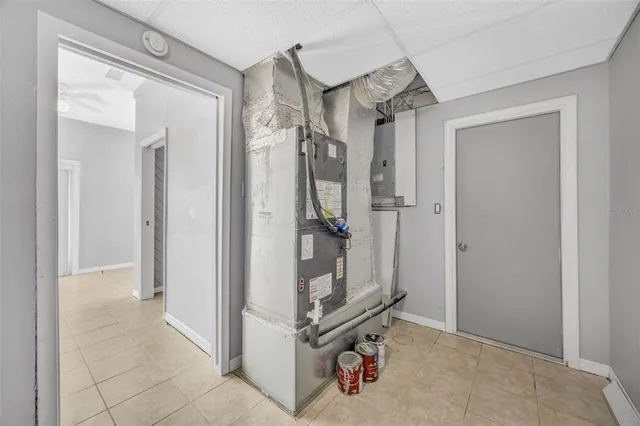 a kitchen with granite countertop a sink stove cabinets and wooden floor