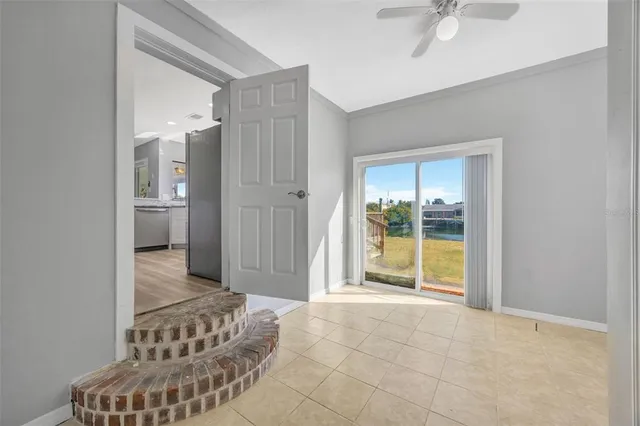 a kitchen with granite countertop a sink cabinets and stainless steel appliances