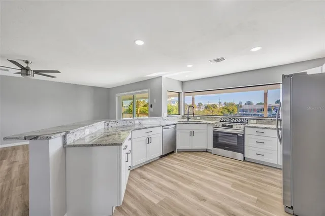 a white toilet sitting next to a bath tub shower