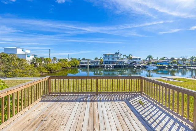 a view of a swimming pool with an outdoor seating and a garden